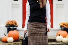 With white button down shirt, checked pencil skirt, brown high boots and black bag