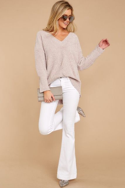 With white flare pants, light gray clutch and printed high heels