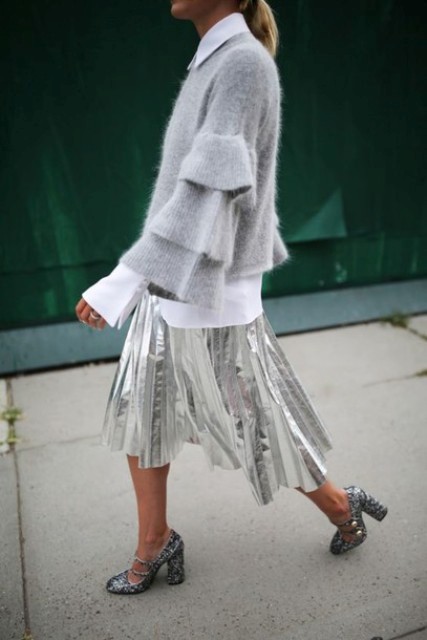 With white long sleeved shirt, silver pleated midi skirt and printed shoes