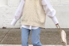 With white puff sleeve shirt, cuffed jeans, white bag and beige lace up boots