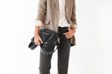 With white ruffled button down shirt, gray cuffed jeans, black embellished bag and black flat shoes