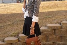 With white shirt, black pleated mini skirt, brown leather bag, black tights and black lace up ankle boots