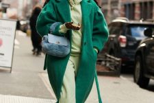 a bright fall outfit with a neon grene hoodie and pants, neon yellow sneakers, an emerald fuzzy coat and a blue faux fur bag