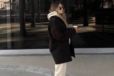 a neutral oversized hoodie and sweatpants, black boots and a black cropped coat for a super cool outfit