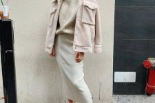 a pretty neutral outfit with a ribbed turtleneck, a creamy pencil skirt, white bootties and a neutral teddy jacket