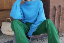 a stylish and cozy fall look with a bold blue sweater, bold green trousers, white slingbacks and a neutral bag is cool
