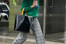 grey plaid trousers, white shoes, a white t-shirt and a green V-neckline jumper plus a black tote for now