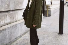 02 a winter outfit with a white sweater, black jeans and hiking boots, a green oversized blazer and a black bag