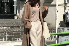 07 an all-neutral outfit with a tan top, creamy trousers, a brown long cardigan and a creamy tote for every day