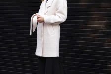 10 an elegant winter outfit with a black turtleneck, a black midi skirt, black hiking boots and a white faux fur coat