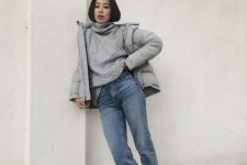 15 a lovely winter look with a grey patterned sweater, light blue jeans, snakeskin print boots, a matte grey puffer jacket