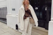 18 a chocolate brown sweatshirt, white jeans, neutral combat boots, a white faux fur coat and a bag