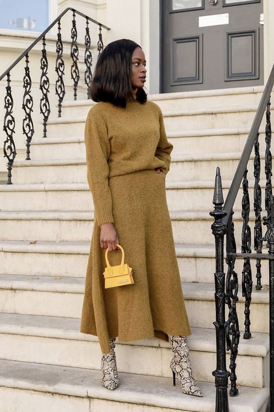 a lovely and comfortable work look with a mustard jumper and an A line midi skirt, snakeskin print boots and a yellow bag