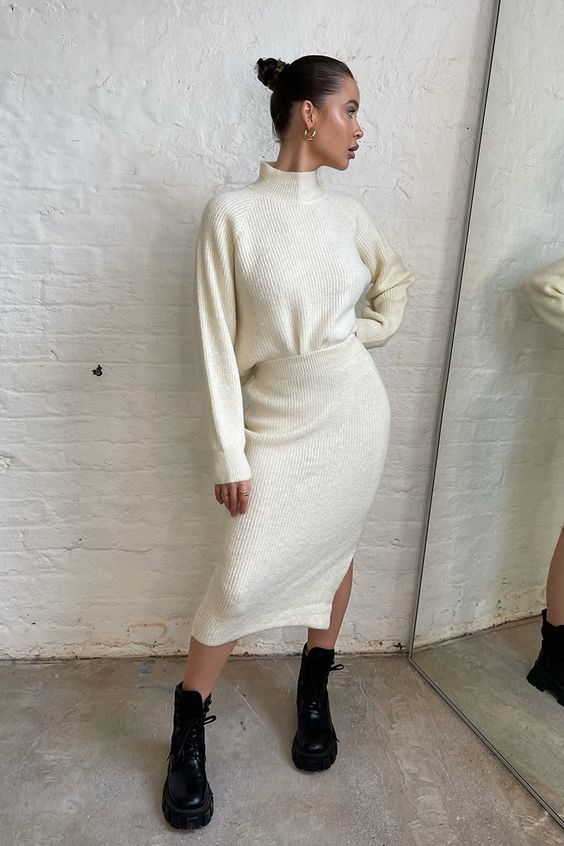 a fresh winter look with a creamy knit suit - a turtleneck and a midi skirt with a slit plus black combat boots
