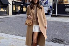 26 a chic winter work outfit with a white shirtdress, a tan sweater, brown knee boots, a tan coat and a bg