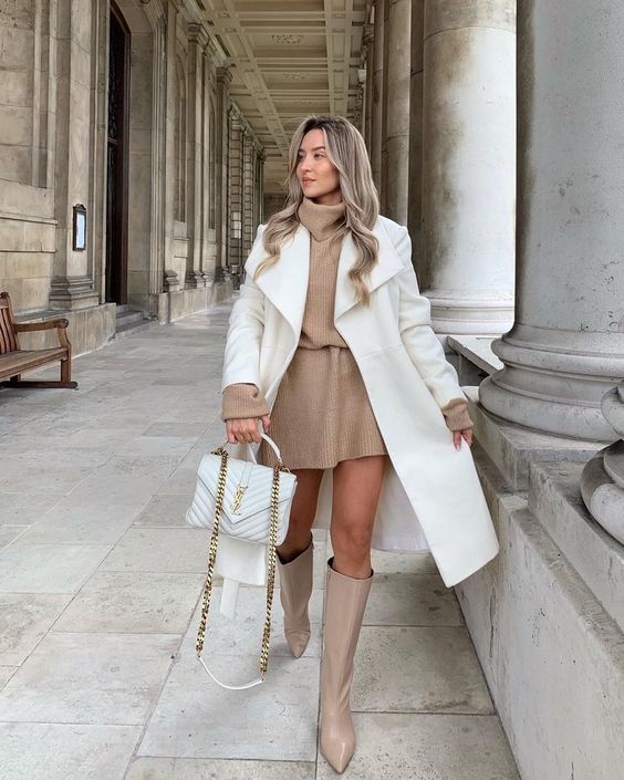 a dreamy winter outfit with a tan sweaterdress, tan knee boots, a white coat and a white bag
