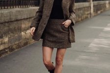 36 a winter work look with a black turtleneck, brown plaid skirt suit, black chunky Chelsea boots