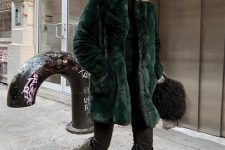 38 a winter outfit with a black turtleneck, skinnies, tall black cowboy boots and a green faux fur jacket