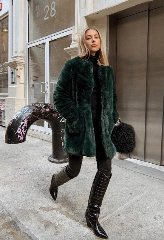 a winter outfit with a black turtleneck, skinnies, tall black cowboy boots and a green faux fur jacket