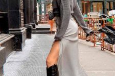 39 a winter look with a grey jumper over a pearly white slip dress, black tall cowboy boots is chic