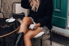 41 a black oversized sweater, a printed mini skirt, black cowboy boots and a black bag for a girlish winter look