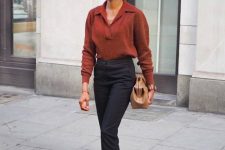 45 a burgundy polo knit, black tailored trousers, black loafers and a large tan bag plus catchy earrings
