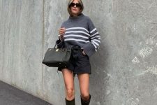 47 a sexy and trendy outfit with a grey oversized striped sweater, a black denim mini, green knee boots and a black tote