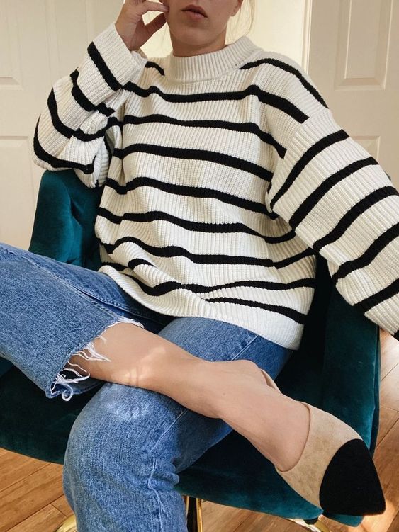 a classic look with a striped ribbed sweater, blue jeans with a raw hem, twon tone shoes is wow