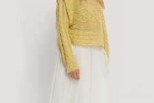 With airy white pleated midi skirt