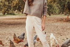 With beige hat, white cropped pants and brown suede ankle boots