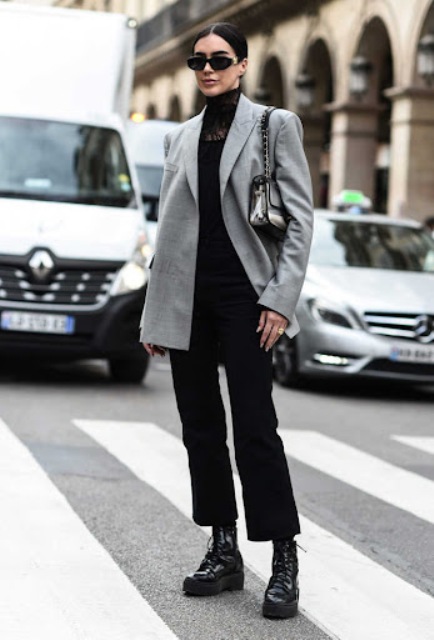 With black lace shirt, black cropped trousers, gray loose blazer and bag