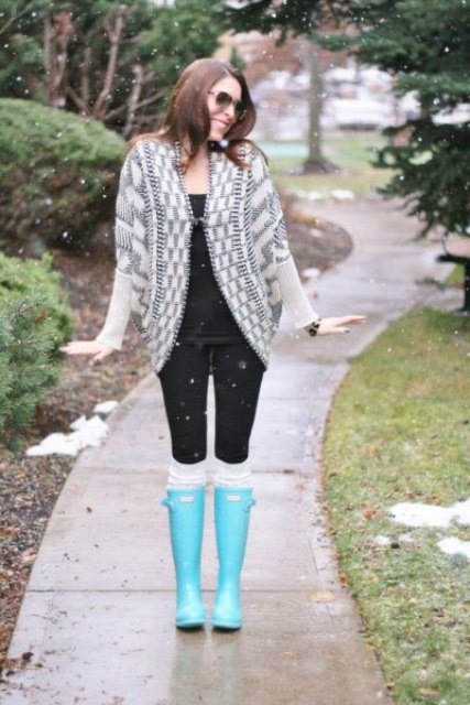 With black shirt, black leggings and gray and white printed cardigan