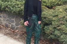 With emerald printed trousers, black leather clutch and black low heel shoes