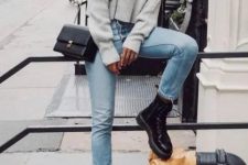 With gray loose sweater, chain strap bag and cropped jeans