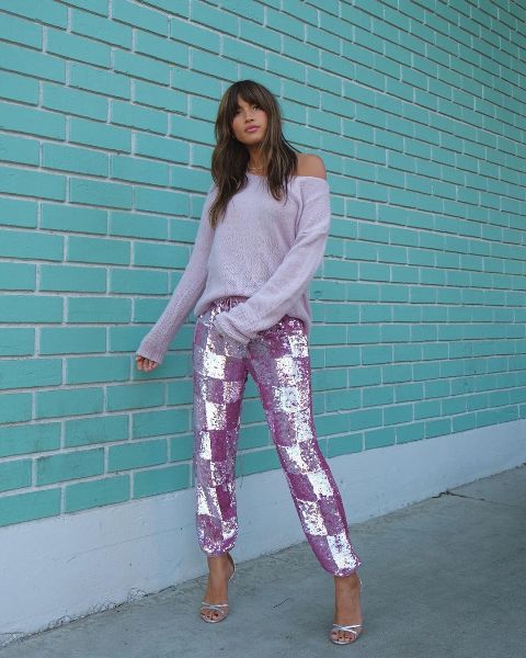 With lilac checked glitter pants and silver high heels