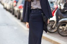 With navy blue midi skirt, black clutch and black leather ankle boots