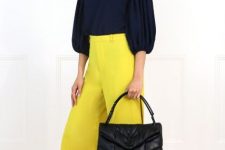 With navy blue puff sleeve blouse, yellow palazzo pants and black flat shoes