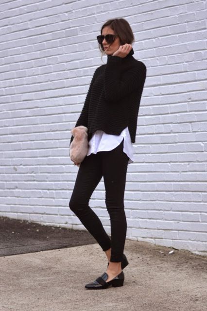 With oversized sunglasses, white loose shirt, pale pink clutch, black skinny pants and black leather low heeled shoes