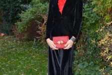 With red blouse, black velvet blazer, red clutch and red shoes