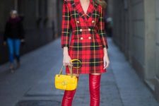 With red leather over the knee boots and yellow chain strap bag