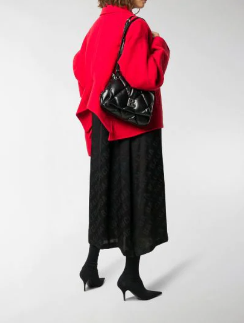 With red loose jacket, black midi skirt and black boots