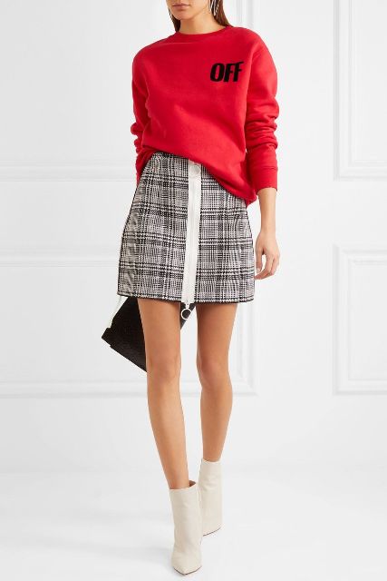 With red loose sweatshirt, black clutch and white ankle boots