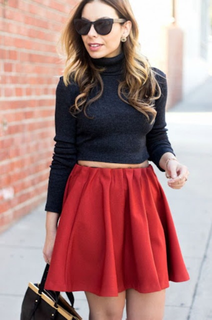 With red pleated mini skirt and black bag
