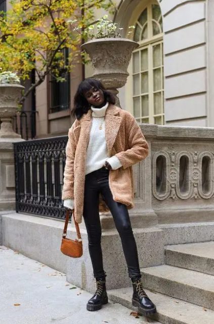 With turtleneck sweater, beige faux fur coat, leather pants and brown mini bag