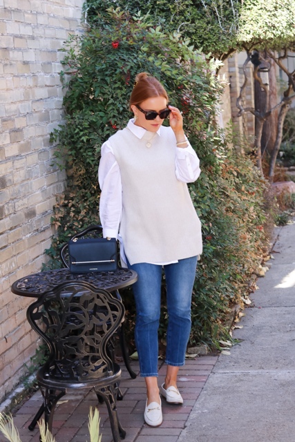 With white button down shirt, black bag, cropped jeans and white flat shoes