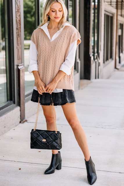 With white button down shirt, black mini skirt, black leather chain strap bag and black ankle boots
