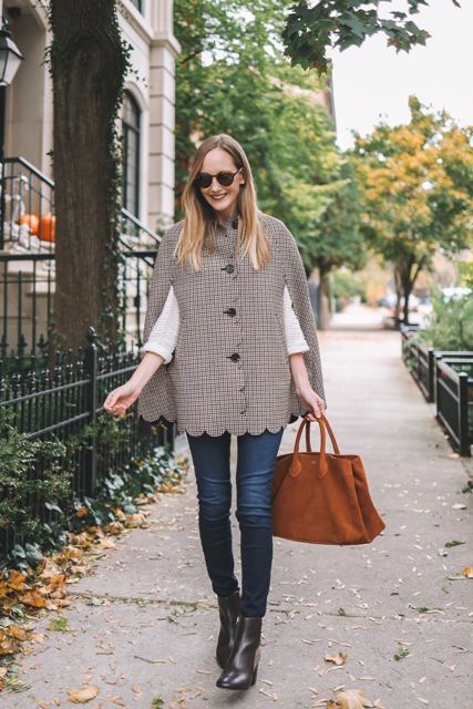 With white sweater, skinny jeans, brown suede tote bag and black ankle boots