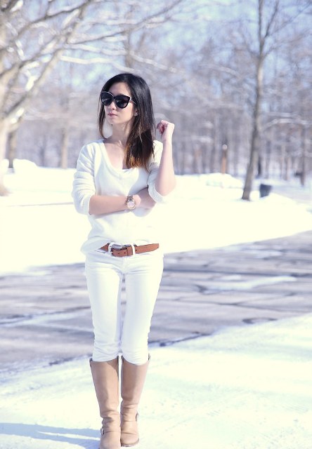 With white sweater, white skinny jeans and brown leather belt