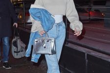 With white top, light blue jeans, denim jacket, silver leather bag and white sneakers