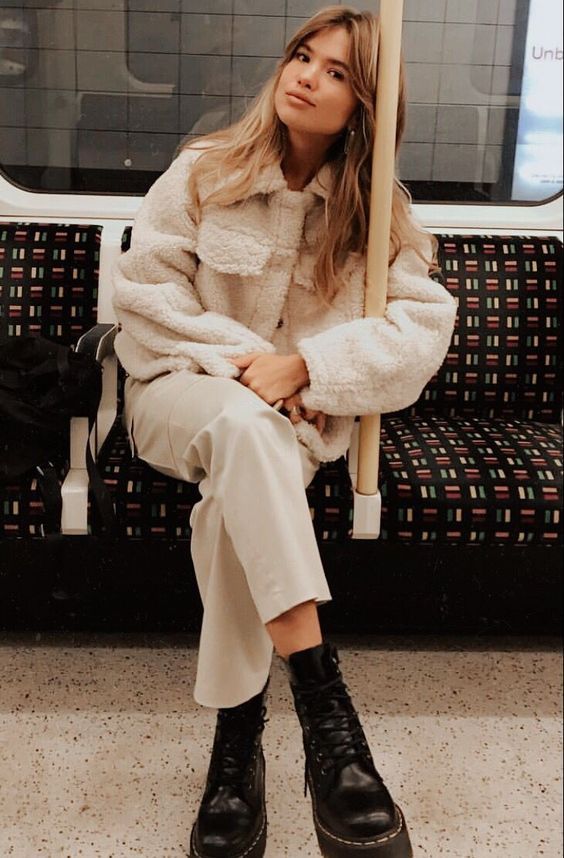 a neutral faux fur coat, neutral trousers, black chunky boots for a lovely and chic winter outfit